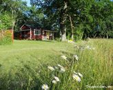 Retro cottages at STF Hagaby hostel near the sea on northern land